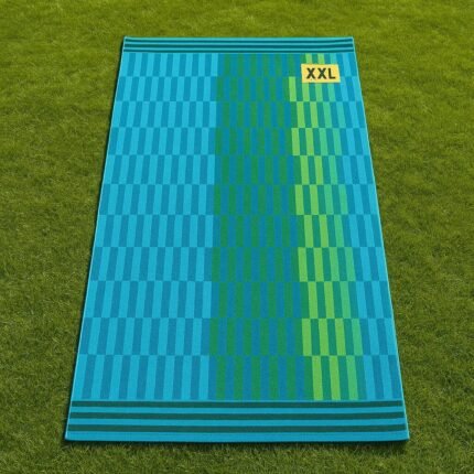 Toalla Playa XXL 100×180 cm en algodón egipcio, cara suave de terciopelo, reverso de rizo absorbente.